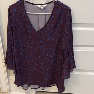 Elegant V-Neck Blouse with Blue Pattern